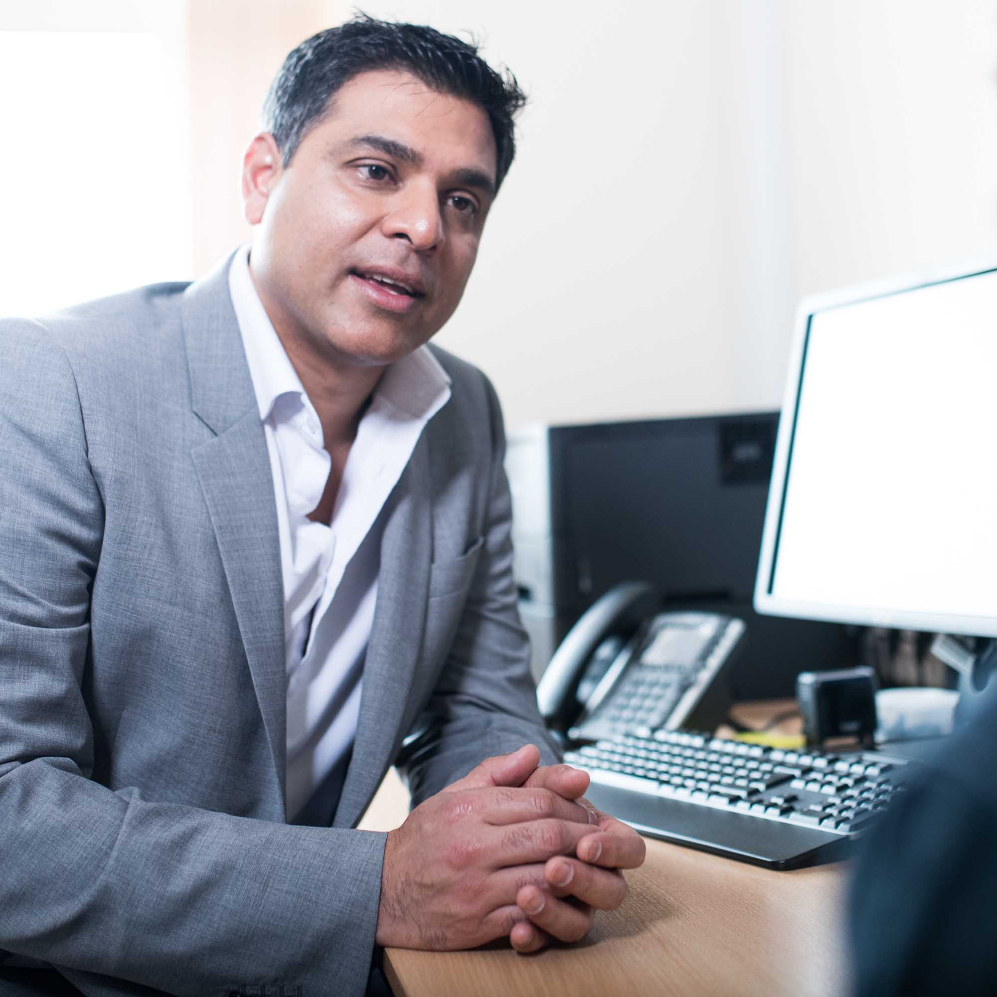 Dr Nishel Patel at a consultation at chiltern private